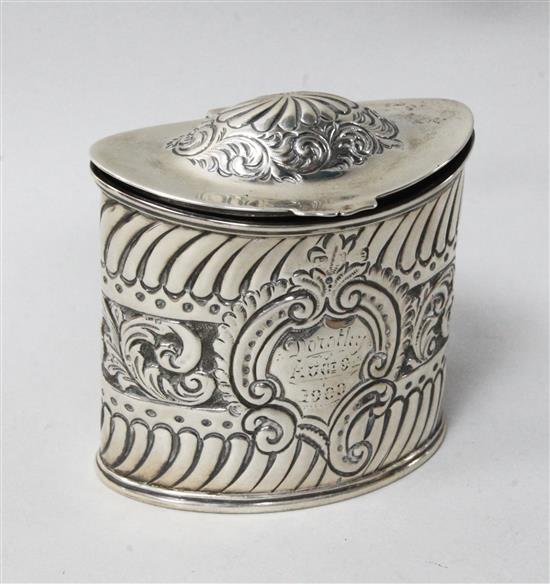 A late Victorian repousse silver oval tea caddy, Birmingham, 1897, 3.9 oz.